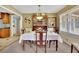 Well-lit dining room with classic wooden furniture and a charming decorative display at 2149 New London Place Pl, Snellville, GA 30078