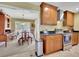 Open-concept kitchen and dining room featuring wooden cabinets and ample counter space at 2149 New London Place Pl, Snellville, GA 30078