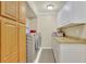 Clean laundry room with modern washer and dryer, storage cabinets, and countertop space at 2149 New London Place Pl, Snellville, GA 30078