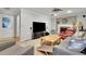 Bright living room with a fireplace, comfortable seating, and a large TV for entertainment at 2149 New London Place Pl, Snellville, GA 30078