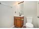 Clean bathroom with wood cabinet, updated vanity, and modern fixtures at 234 Riverstone Commons Cir, Canton, GA 30114