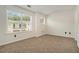 Cozy bedroom with new carpet, neutral paint, and bright windows offering lots of natural light at 234 Riverstone Commons Cir, Canton, GA 30114