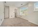 Spacious bedroom features neutral paint, closet, and bright windows at 234 Riverstone Commons Cir, Canton, GA 30114