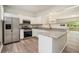 Well-lit kitchen boasting stainless steel appliances, granite countertops, and an open design at 234 Riverstone Commons Cir, Canton, GA 30114