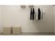 Organized closet with hanging racks, shelving, and storage space for clothes and accessories at 2464 Cotton Ln, Douglasville, GA 30135