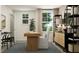 Inviting home office with modern desk, natural light from large windows, and elegant decorative accents at 2464 Cotton Ln, Douglasville, GA 30135