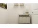Functional laundry room with storage shelves, organization bins, and neutral color scheme at 2464 Cotton Ln, Douglasville, GA 30135