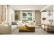 Bright and airy living room featuring neutral tones, modern furniture, and a seamless connection to the kitchen at 2464 Cotton Ln, Douglasville, GA 30135