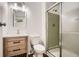 Bathroom featuring a wood vanity, updated fixtures, and a glass-enclosed shower for a modern touch at 2948 Sagewood Dr, Snellville, GA 30039
