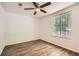 Bedroom with wood floors and a large window, offering a bright and airy space for relaxation at 2948 Sagewood Dr, Snellville, GA 30039