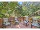 Outdoor deck with four patio chairs with trees providing shade at 2948 Sagewood Dr, Snellville, GA 30039