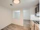 Kitchen area with grey cabinets, stainless steel appliances, and hardwood flooring at 2948 Sagewood Dr, Snellville, GA 30039