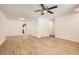This open-concept living room features wood floors, fresh paint, and a modern ceiling fan at 2948 Sagewood Dr, Snellville, GA 30039