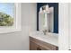 Stylish powder room showcasing a marble countertop, elegant fixtures, and contemporary design at 327 Ohm Ave, Avondale Estates, GA 30002