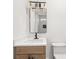 Modern bathroom featuring a sleek vanity, contemporary lighting, and stylish mirror at 327 Ohm Ave, Avondale Estates, GA 30002