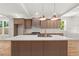 Gourmet kitchen featuring a marble countertop island, custom cabinetry, and modern appliances at 327 Ohm Ave, Avondale Estates, GA 30002