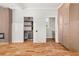 Versatile living area with hardwood floors, built-in storage, and a modern wine fridge at 327 Ohm Ave, Avondale Estates, GA 30002