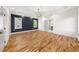 Spacious primary bedroom features hardwood flooring, accent wall and en-suite bathroom at 327 Ohm Ave, Avondale Estates, GA 30002