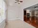 Bright breakfast nook with tile flooring, view to the open living area and hardwood floors at 6350 Manningtree Ct, Cumming, GA 30041