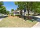 Well-kept home shows stone detailing, green lawn, and attached two-car garage at 6350 Manningtree Ct, Cumming, GA 30041