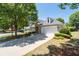 Attractive home featuring stone accents, neat landscaping, and a convenient two-car garage at 6350 Manningtree Ct, Cumming, GA 30041