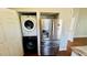 Stainless steel refrigerator and stacked washer-dryer hidden in a closet for convenience at 1972 Brittania Cir, Woodstock, GA 30188