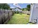 Lush backyard with a wood fence, providing a serene outdoor space at 1972 Brittania Cir, Woodstock, GA 30188