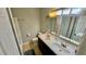 Bathroom featuring a double sink vanity, tile floor, and neutral color scheme at 1972 Brittania Cir, Woodstock, GA 30188