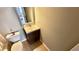 Powder room featuring a toilet, vanity with a small sink, and a decorative mirror at 1972 Brittania Cir, Woodstock, GA 30188