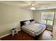 Bedroom featuring hardwood floors, natural light, and neutral color scheme at 1972 Brittania Cir, Woodstock, GA 30188
