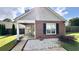 Charming front exterior showcasing a mix of brick and siding, with a cozy covered porch at 1972 Brittania Cir, Woodstock, GA 30188