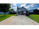 Single-story home with a well-kept lawn, a covered entryway and a mix of brick and siding at 1972 Brittania Cir, Woodstock, GA 30188