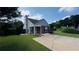Charming home with a neatly maintained lawn and a covered entryway, enhanced by lush landscaping at 1972 Brittania Cir, Woodstock, GA 30188