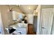 Bright kitchen featuring granite countertops, white cabinets, and stainless steel appliances at 1972 Brittania Cir, Woodstock, GA 30188