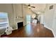 Spacious living room with hardwood floors, vaulted ceilings, and direct access to a modern kitchen at 1972 Brittania Cir, Woodstock, GA 30188
