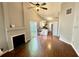 Bright, open living room with hardwood floors, vaulted ceiling, and a cozy fireplace at 1972 Brittania Cir, Woodstock, GA 30188