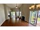 Inviting living room featuring hardwood floors, fireplace, and natural light from sliding glass doors at 1972 Brittania Cir, Woodstock, GA 30188