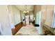Open floorplan showcasing the kitchen and living room's hardwood floors and natural light at 1972 Brittania Cir, Woodstock, GA 30188