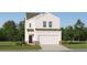 Charming two-story home with attached garage, landscaped lawn and a classic colonial facade at 2288 Linden Pass, Douglasville, GA 30135