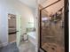 Modern bathroom with large glass shower and a soaking tub at 2521 Livingston Ct, Loganville, GA 30052