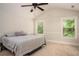 Serene bedroom with vaulted ceilings, plush carpeting, and ample natural light at 2521 Livingston Ct, Loganville, GA 30052
