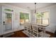 Cozy dining area with a table and chairs, bathed in natural light from the windows at 2521 Livingston Ct, Loganville, GA 30052