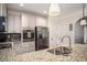 Bright kitchen with stainless steel appliances, granite countertops, and an undermount sink at 2521 Livingston Ct, Loganville, GA 30052