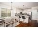 Bright kitchen with stainless steel appliances, granite counters, and a breakfast bar with seating at 2521 Livingston Ct, Loganville, GA 30052