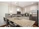 Stylish kitchen with stainless steel appliances, granite countertops, and a breakfast bar at 2521 Livingston Ct, Loganville, GA 30052