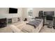 Comfortable living room area with neutral colors and lots of electronics at 2521 Livingston Ct, Loganville, GA 30052