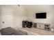 Living room area with large mounted television and entertainment center at 2521 Livingston Ct, Loganville, GA 30052