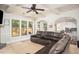 Cozy living room featuring a coffered ceiling, large windows, and an open layout at 2521 Livingston Ct, Loganville, GA 30052