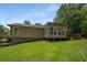 Back yard featuring a sloped lawn, deck, fenced perimeter, and lots of trees at 2795 Bentwood Dr, Marietta, GA 30062