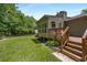 Back yard featuring a deck, wooden railing, and lush green landscape at 2795 Bentwood Dr, Marietta, GA 30062